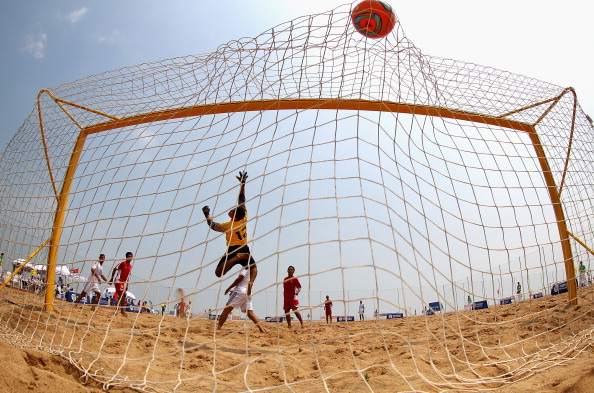 HAIYANG, CHINA - JUNE 16: Trang D Huang of Vietnam misses a save during the Men's Beach Soccer Preliminary match between Vietnam and Palestine on Day 0 of the 3rd Asian Beach Games Haiyang 2012 at Fengxiang Beach on June 16, 2012 in Haiyang, China. (Photo by Ryan Pierse/Getty Images)